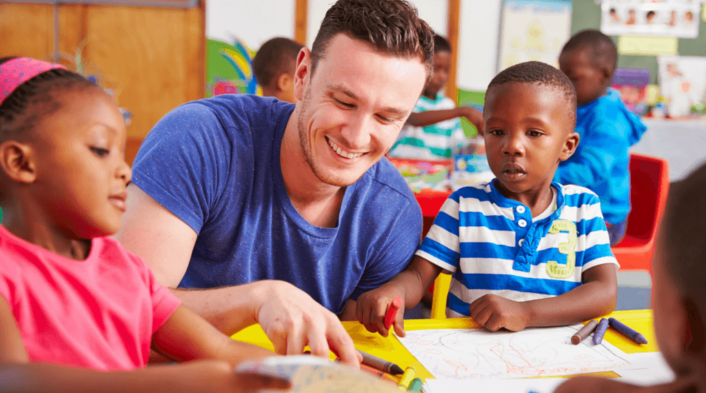 MaleTeacherYoungKidsatTable